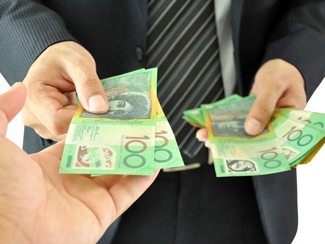 Businessman hand giving money  - Australian dollars