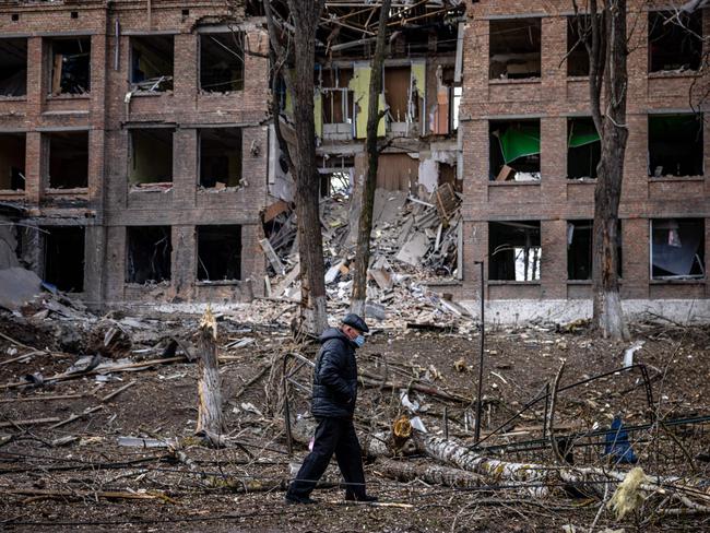 A man walks in front of a destroyed building after a Russian missile attack in the town of Vasylkiv, near Kyiv. Picture: AFP