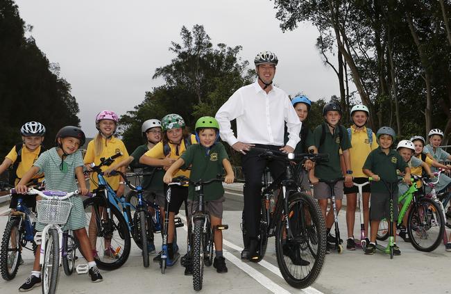 Mr Regan at the Macpherson Street bridge and roadway opening last year.