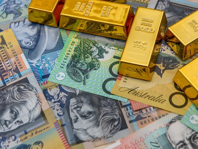 Golden bullion at australian dollar banknotes close up Stock photo for AgJournal's Twenty for the 2020s feature.