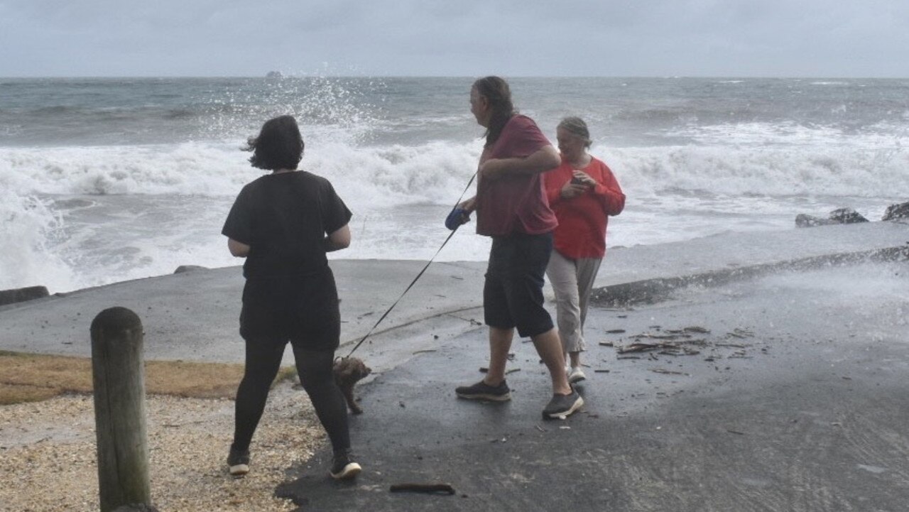 Main Beach in Byron Bay remained closed but many visitors and residents decided to check out the high tide on Tuesday morning.