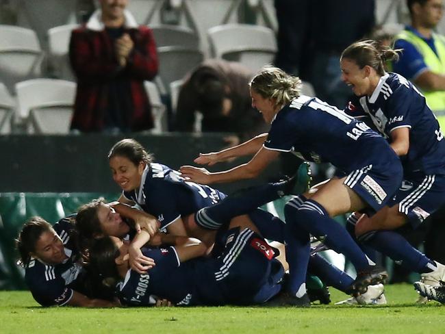 Cooney-Cross is mobbed after scoring the match winning goal in the 2021 W-League Grand Final. Picture: Jason McCawley/Getty Images