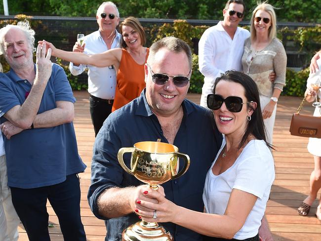 Melbourne Cup arrives at The Prince of Wales Hotel in St Kilda. Owners Nick and Saskia Williams (front) with the Melbourne Cup. Picture: Josie Hayden