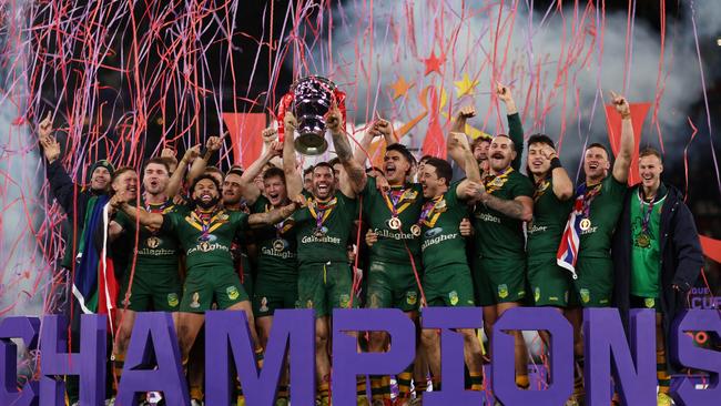 James Tedesco of Australia lifts the Rugby League World Cup trophy w