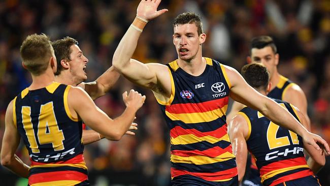 Josh Jenkins of the Crows celebrates after kicking a goal.