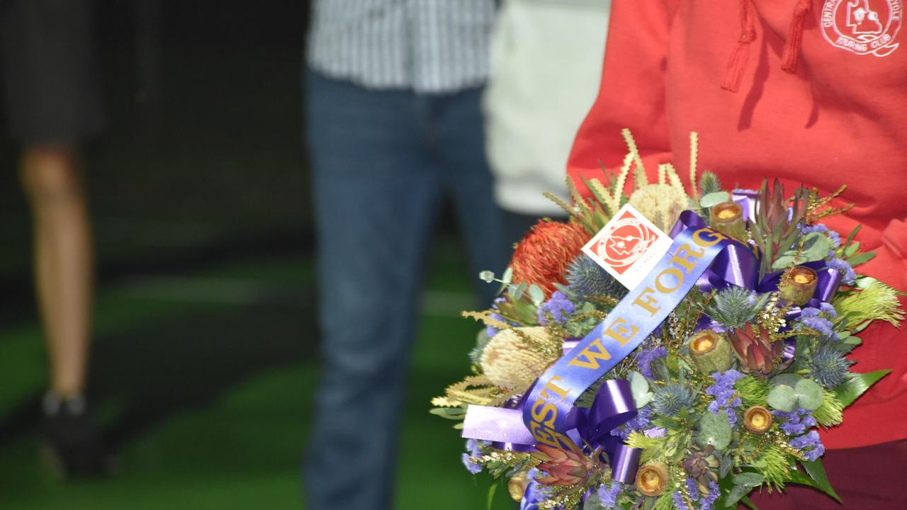 A wreath being placed at the Kuttabul dawn service at the Hampden State School Remembrance Garden 2021. Picture: Lillian Watkins