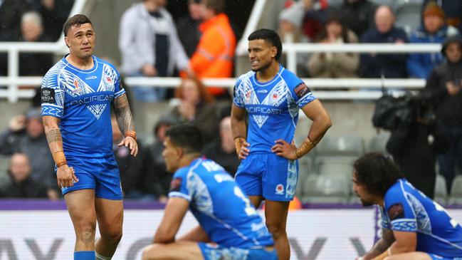 Dejected Samoan players were among the world cup favourites at the start of the tournament, but now their hopes are hanging by a thread. Picture: Getty Images