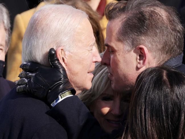 WASHINGTON, DC - JANUARY 20: U.S. President Joe Biden hugs his son Hunter Biden, wife Dr. Jill Biden and daughter Ashley Biden after being sworn in as U.S. president during his inauguration on the West Front of the U.S. Capitol on January 20, 2021 in Washington, DC. During today's inauguration ceremony Joe Biden becomes the 46th president of the United States.   Alex Wong/Getty Images/AFP == FOR NEWSPAPERS, INTERNET, TELCOS & TELEVISION USE ONLY ==