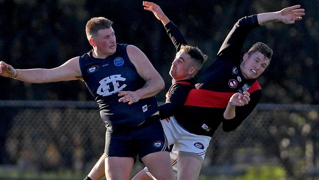 Epping and Eltham players clash in a marking contest. Picture: Andy Brownbill