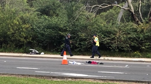 Forest Way was closed in both directions as emergency services cleared the area. Picture: Jim O'Rourke