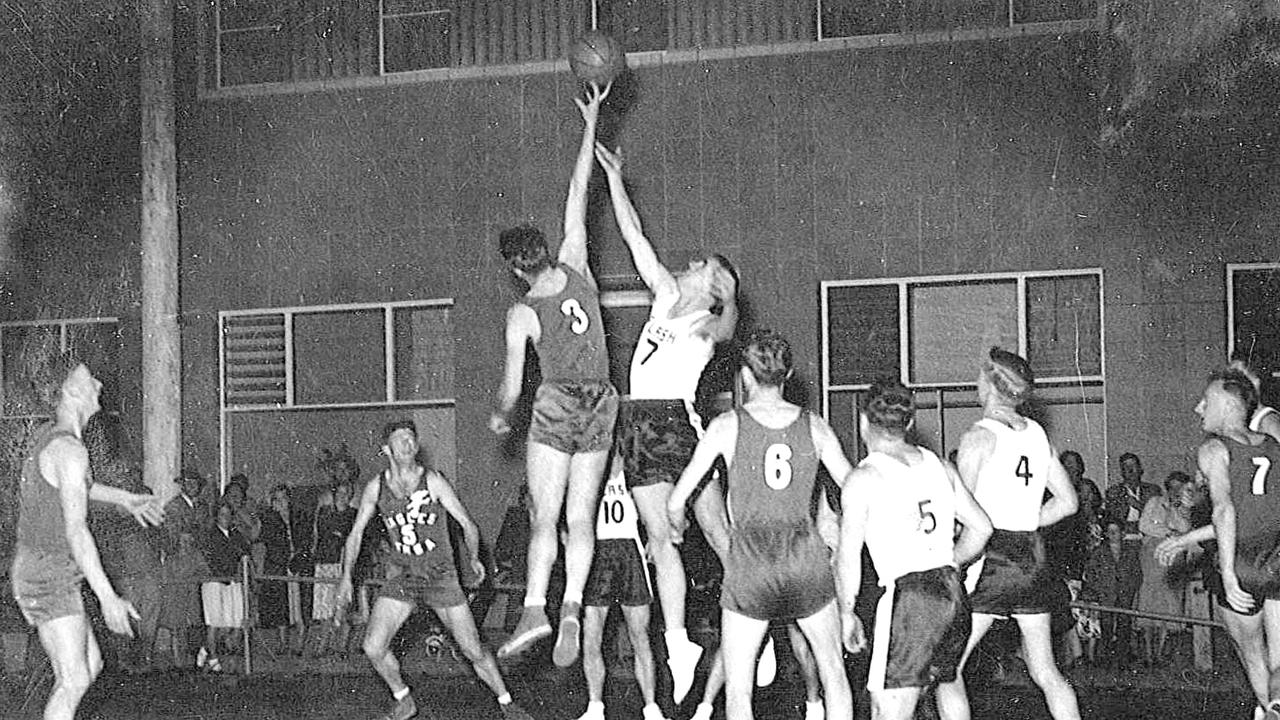 Eagles play Saints in Margaret St in 1955 when basketball was played during the Carnival of Flowers street carnival in the 1950s and 1960s.