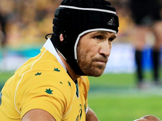 An injured Matt Giteau during the Wallabies v All Blacks Bledisloe Cup game 1 at ANZ Stadium, Sydney Olympic Park. pic Mark Evans