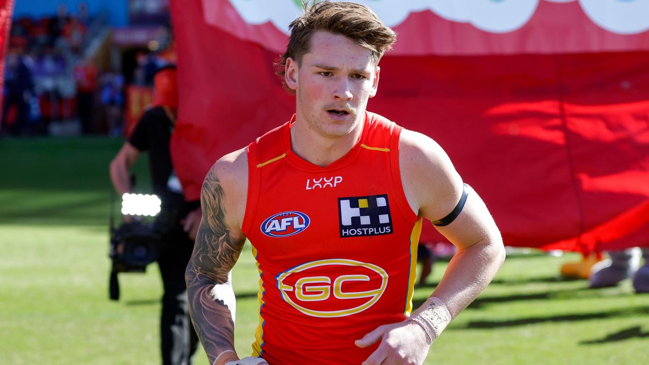 GOLD COAST, AUSTRALIA - JULY 14: The Gold Coast Suns enter the field prior to the 2024 AFL Round 18 match between the Gold Coast SUNS and Port Adelaide Power at People First Stadium on July 014, 2024 in Gold Coast, Australia. (Photo by Russell Freeman/AFL Photos via Getty Images)