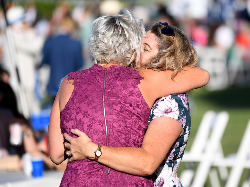 Racegoers enjoy the Melbourne Cup race-day at Doomben Racecourse.