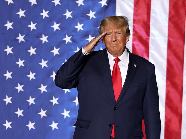 MINDEN, NEVADA - OCTOBER 08: Former U.S. President Donald Trump salutes supporters during a campaign rally at Minden-Tahoe Airport on October 08, 2022 in Minden, Nevada. Former U.S. President Donald Trump held a campaign style rally for Nevada GOP candidates ahead of the state's midterm election on November 8th.   Justin Sullivan/Getty Images/AFP