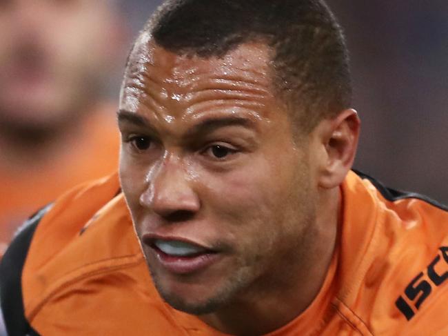 SYDNEY, AUSTRALIA - JULY 21:  Moses Mbye of the Tigers takes on the defence during the round 19 NRL match between the Wests Tigers and the South Sydney Rabbitohs at ANZ Stadium on July 21, 2018 in Sydney, Australia.  (Photo by Matt King/Getty Images)