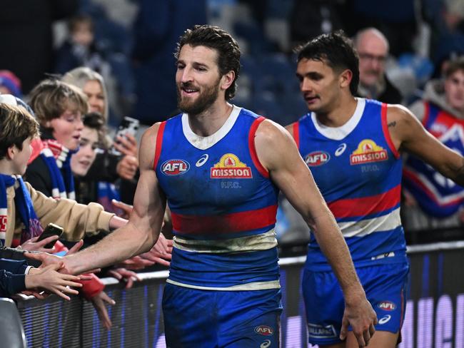 GEELONG, AUSTRALIA - JULY 20: Marcus Bontempelli of the Bulldogs and Jamarra Ugle-Hagan of the Bulldogs greet fans after winning the round 19 AFL match between Geelong Cats and Western Bulldogs at GMHBA Stadium, on July 20, 2024, in Geelong, Australia. (Photo by Daniel Pockett/Getty Images)