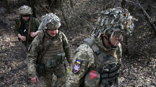 Ukrainian servicemen are seen at a position on the front line with Russia-backed separatists near the town of Schastia, near the eastern Ukraine city of Lugansk, on February 23.