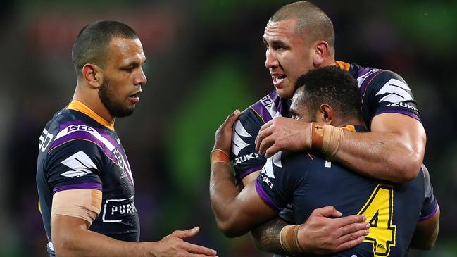 Nelson Asofa-Solomona, Justin Olam and Will Chambers celebrate Storm’s win.