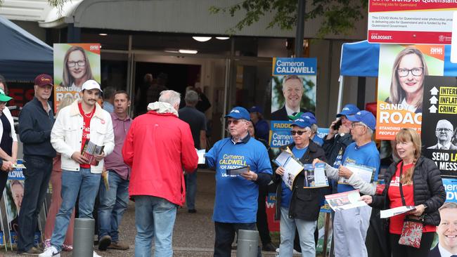 Candidates and their supporters greet voters at Runaway Bay Sports Centre when pre-poll voting opened for the seat of Fadden on Monday morning. Picture Glenn Hampson