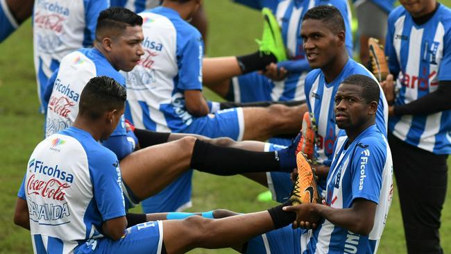 Honduras' players stretch during a training session in San Pedro Sula, Honduras.