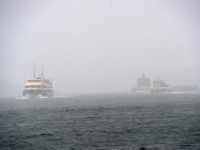 Continual rain hampers Sydney-siders and visitors day out in the CBD and along the harbour. Photo Jeremy Piper