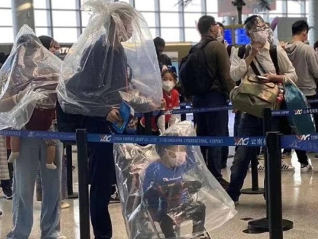 This family weren’t taking any chances, opting for the full body plastic bag coverings. Picture: Supplied