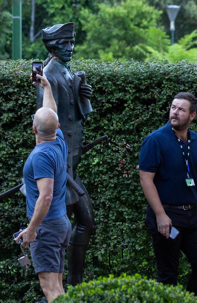 Melbourne Council staff inspect damage to the Captain Cook statue at the Fitzroy Gardens. Picture: Jason Edwards