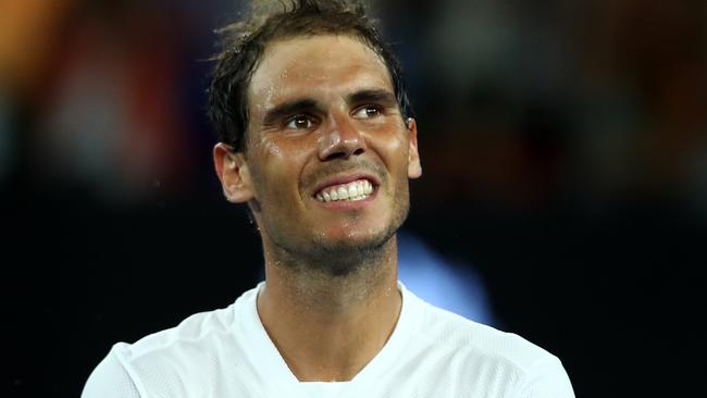 Rafael Nadal of Spain celebrates victory to the crowd in his fourth round match against Gael Monfils.