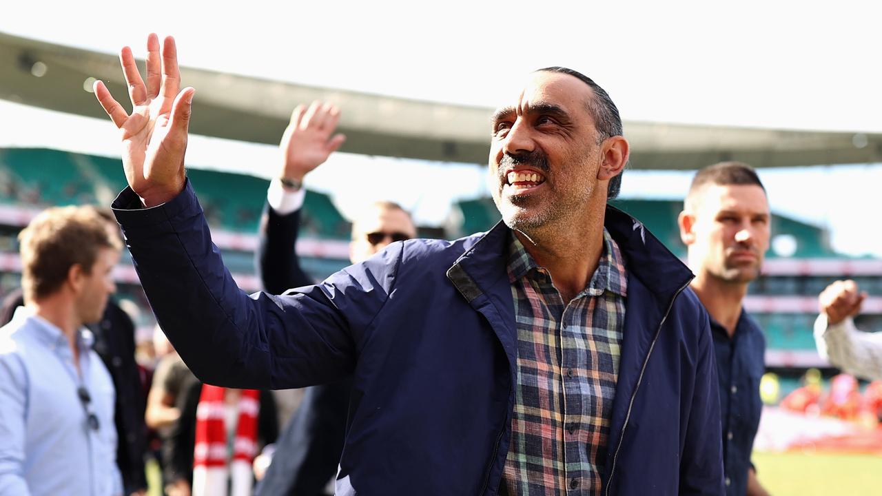 SYDNEY, AUSTRALIA - MAY 07: Former Swan Adam Goodes and team mates from the 2012 Premiership winning team walk a lap of honour during the round eight AFL match between the Sydney Swans and the Gold Coast Suns at Sydney Cricket Ground on May 07, 2022 in Sydney, Australia. (Photo by Cameron Spencer/Getty Images)