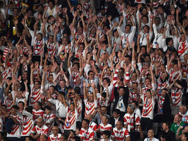 Japan fans cheer on their team.