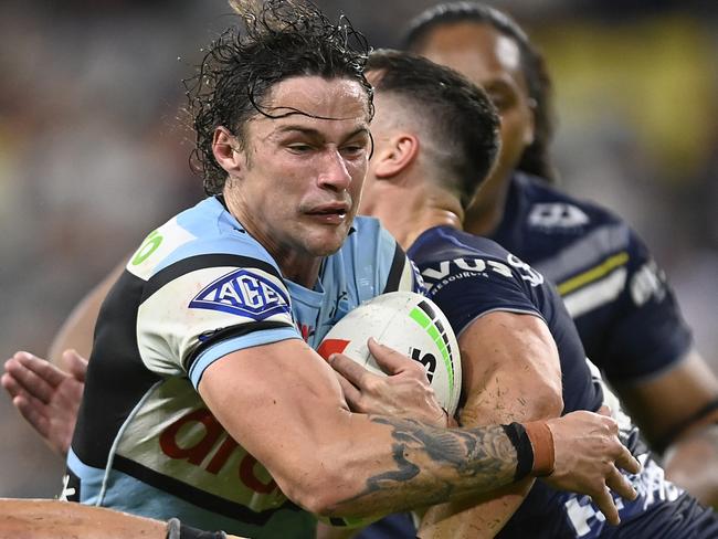 TOWNSVILLE, AUSTRALIA - AUGUST 17: Nicho Hynes of the Sharks makes a break to score a try during the round 25 NRL match between North Queensland Cowboys and Cronulla Sharks at Qld Country Bank Stadium on August 17, 2023 in Townsville, Australia. (Photo by Ian Hitchcock/Getty Images)