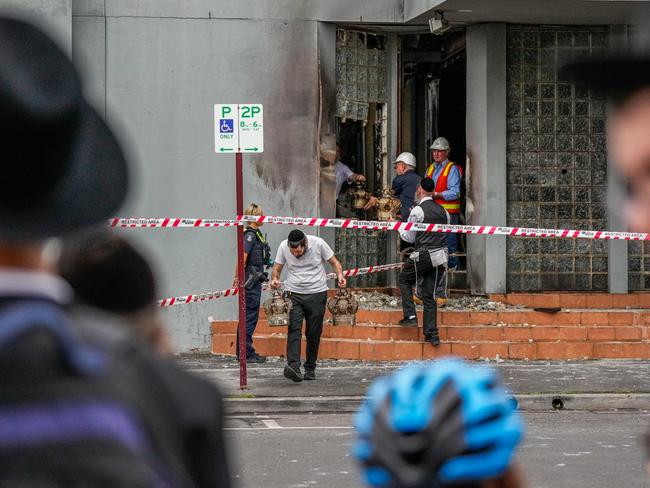 Members of the synagogue recover items after the blaze. Picture: Getty Images