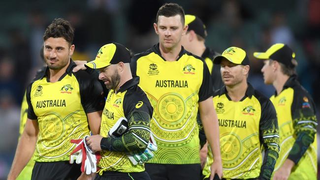 ADELAIDE, AUSTRALIA - NOVEMBER 04: Marcus Stoinis and Matthew Wade of Australia react following the ICC Men's T20 World Cup match between Australia and Afghanistan at Adelaide Oval on November 04, 2022 in Adelaide, Australia. (Photo by Mark Brake-ICC/ICC via Getty Images)