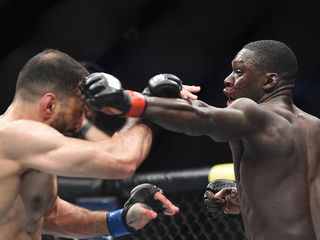 Curtis Millender punches Belal Muhammad during UFC 236. Picture: Logan Riely/Getty Images/AFP