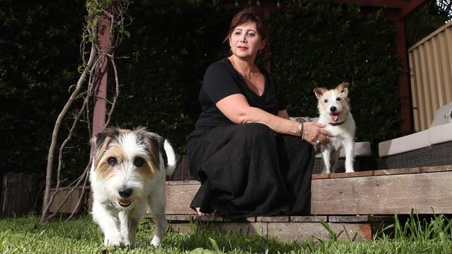 Julie Zannes-Dowker with her dogs Banjo (left) and Matilda at her Miami home. Picture: Glenn Hampson.