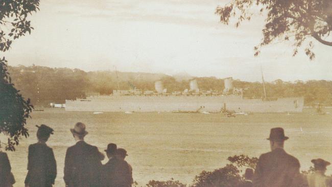 A crowd gathers to watch as the Queen Mary arrives in Sydney Harbour in 1940. Picture: Dick Stewart