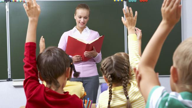 Generic image of teacher teaching students inside school classroom.