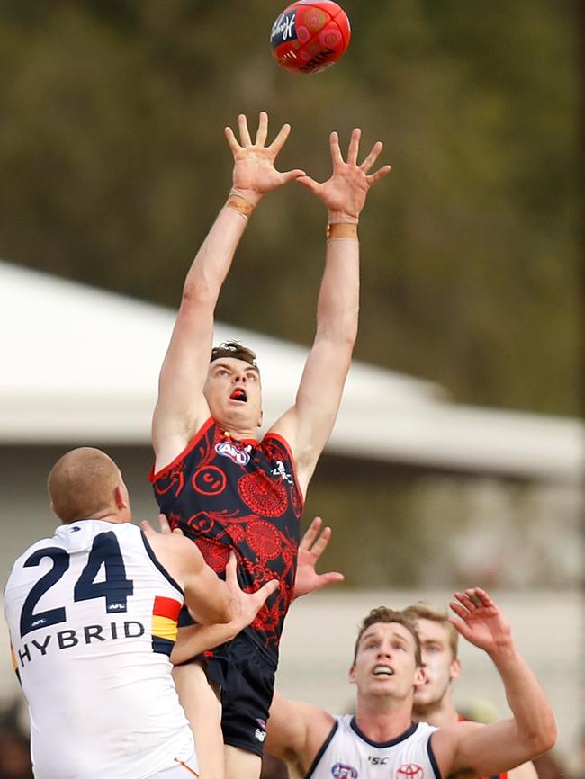 Former Crow Jake Lever flies for a grab for the Demons on Sunday. Picture: Michael Willson/AFL Media/Getty Images