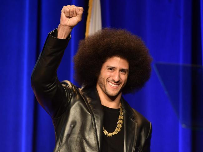 (FILES) In this file photo taken on December 3, 2017, Honoree Colin Kaepernick speaks onstage at ACLU SoCal Hosts Annual Bill of Rights Dinner at the Beverly Wilshire Four Seasons Hotel in Beverly Hills, California. - Former San Francisco 49ers quarterback Colin Kaepernick has been chosen as the face of a new Nike advertising campaign to mark the 30th anniversary of the company's iconic "Just Do It" slogan, it was confirmed on September 4, 2018. Kaepernick -- who triggered a political firestorm after kneeling during the US national anthem in 2016 to protest racial injustice -- has not played in the NFL since early last year.The 30-year-old is suing the NFL, claiming he has been frozen out of the league by team owners because of his activism. (Photo by Matt Winkelmeyer / GETTY IMAGES NORTH AMERICA / AFP)