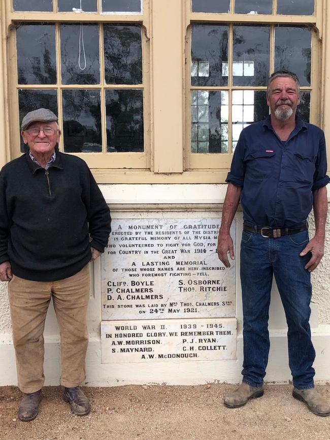 Bob Rollinson and Raymond Chalmers, who are both descendants of the Chalmers family mentioned on the school's foundation stone (pictured).