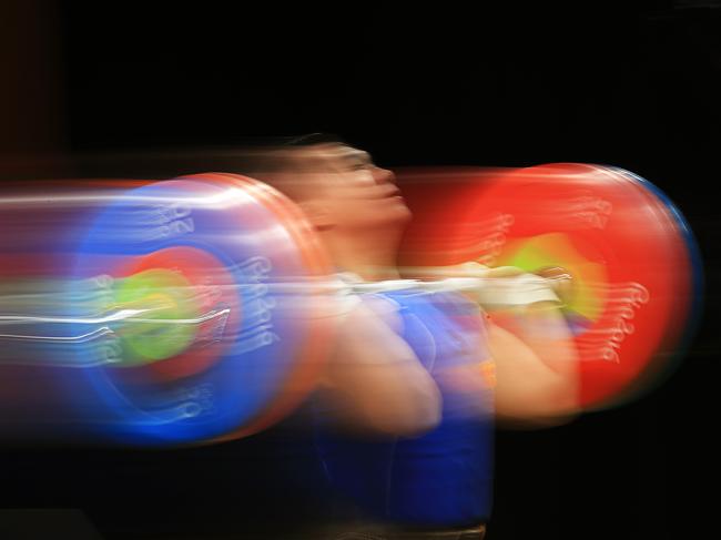 RIO DE JANEIRO, BRAZIL - AUGUST 12: Tan Tai Hoang of Vietnam in action during the Weightlifting - Men's 85kg Group B on Day 7 of the Rio 2016 Olympic Games at Riocentro - Pavilion 2 on August 12, 2016 in Rio de Janeiro, Brazil. (Photo by Mike Ehrmann/Getty Images)