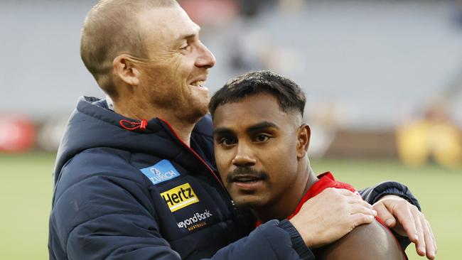 MELBOURNE, AUSTRALIA - MARCH 23: Simon Goodwin, Senior Coach of the Demons and Kysaiah Pickett of the Demons embrace after  the round two AFL match between Hawthorn Hawks and Melbourne Demons at Melbourne Cricket Ground, on March 23, 2024, in Melbourne, Australia. (Photo by Darrian Traynor/Getty Images)