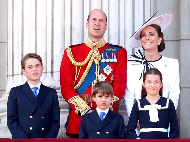 Prince George, Prince Louis and Princess Charlotte with parents Prince William and Princess Catherine watch Trooping the Colour at Buckingham Palace in June. Picture: Getty Images