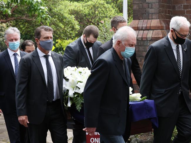 DAILY TELEGRAPH. NOVEMBER 8, 2021.The funeral of cricket test legend, Alan Davidson at St Annes Anglican Church in Strathfield today with former PM John Howard and many cricket legends in attendance. The casket is carried out of the church by several former captains, (left) Steve Waugh, Mark Taylor and Ian Chappell. Picture: David Swift