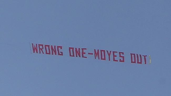 A plane flies overhead with a banner criticising Moyes in the match between United and Aston Villa.