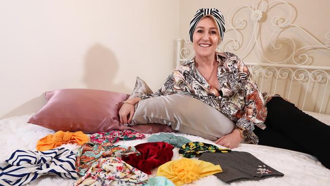 Sam Corbett with her The Bald &amp; The Beautiful turbans. Photograph: Jason O'Brien