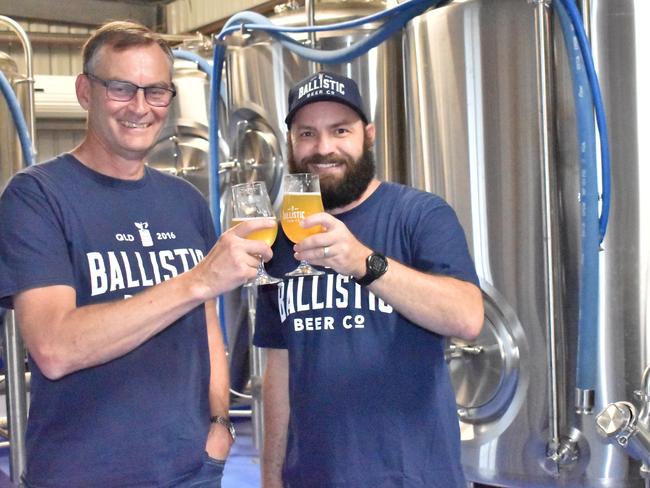 Ballistic Brewing Co's founder David Kitchen and resident Whitsundays brewer Liam Paget celebrate the opening of the new Cannonvale venue. Picture: Kirra Grimes.