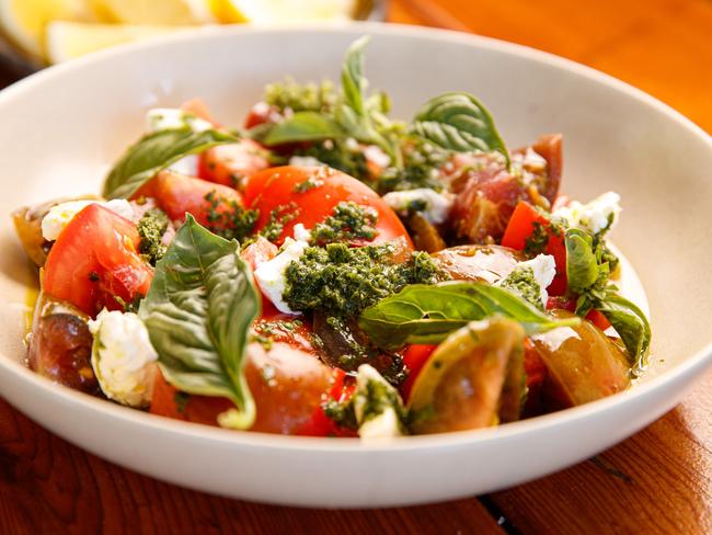 A fresh tomato salad adds colour and is perfect on a hot Christmas day. Photo: Matt Turner