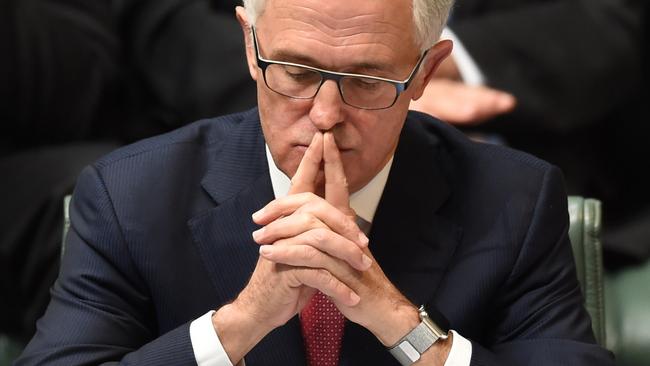 Australian Prime Minister Malcolm Turnbull reacts during House of Representatives Question Time at Parliament House in Canberra, Wednesday, Dec. 2, 2015. (AAP Image/Lukas Coch) NO ARCHIVING